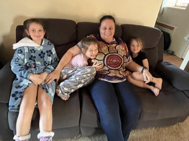 Kora, Mia and Zara with their mum, Michelle Brown in their home on the Fraser Coast. Michelle survived an terrifying anaphylactic reaction to tomatoes thanks to the quick thinking of Mia, 7.