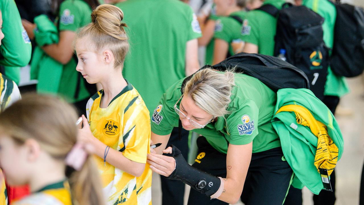 The Matildas were greeted by a swarm of fans in Adelaide.