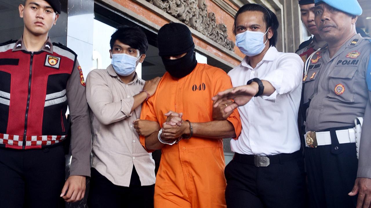 Lamar Ahchee is escorted by Bali police. Picture: Lukman S. Bintoro