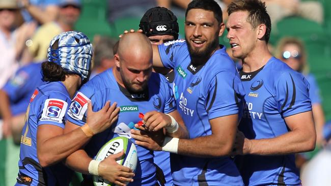 **FILE** A Sunday, April 9, 2017 image reissued Monday, April 10, 2017 of Force celebrate during the Round 7 Super Rugby match between the Western Force and the Southern Kings at NIB Stadium in Perth. The Western Force and Melbourne Rebels will learn within three days which of them is to be axed, Australian Rugby Union chairman Cameron Clyne says. It's part of a broader restructure of an unwieldy and unpopular Super Rugby competition format, which is to be slashed from 18 teams to 15 after this season, with two South African sides also to go. (AAP Image/Richard Wainwright) NO ARCHIVING, EDITORIAL USE ONLY