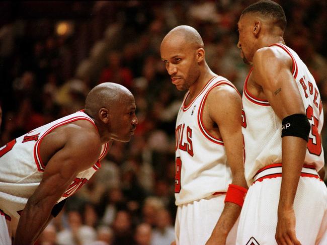 Michael Jordan (left), Ron Harper (middle), and Scott Pippen (right).