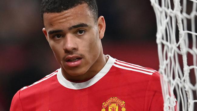 (FILES) In this file photo taken on January 03, 2022 Manchester United's English striker Mason Greenwood is substituted during the English Premier League football match between Manchester United and Wolverhampton Wanderers at Old Trafford in Manchester, north west England. - Manchester United's Mason Greenwood will not return to training or playing "until further notice", the English Premier League giants said in a statement released on January 30, 2022, after a woman accused him of assault. (Photo by Paul ELLIS / AFP) / RESTRICTED TO EDITORIAL USE. No use with unauthorized audio, video, data, fixture lists, club/league logos or 'live' services. Online in-match use limited to 120 images. An additional 40 images may be used in extra time. No video emulation. Social media in-match use limited to 120 images. An additional 40 images may be used in extra time. No use in betting publications, games or single club/league/player publications. /