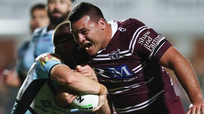 Lloyd Perrett of the Sea Eagles is tackled by the Sharks defence during the First NRL Elimination Final between the Manly Sea Eagles and the Cronulla Sharks at Lottoland in Sydney, Saturday, September 14, 2019. (AAP Image/Brendon Thorne) NO ARCHIVING, EDITORIAL USE ONLY