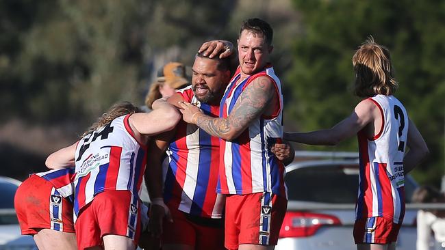 Lindenow South players celebrate after winning the grand final. Picture: Yuri Kouzmin