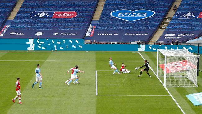 Aubameyang scores the opening goal against Manchester City. Picture: AFP