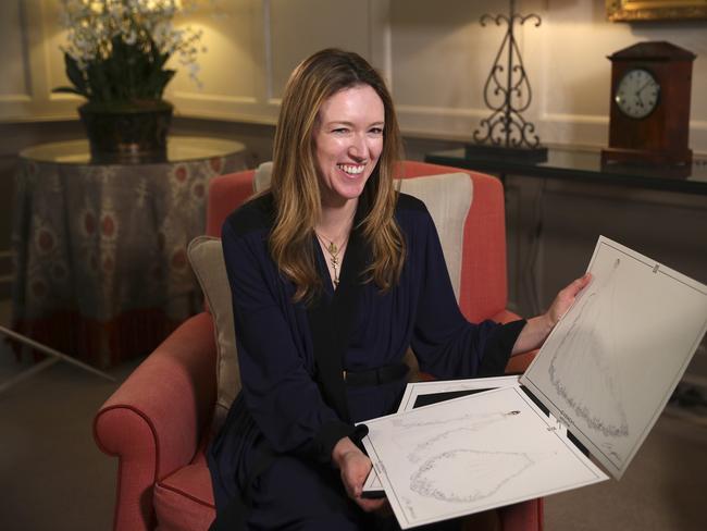 Givenchy designer Clare Waight Keller shows off some of her sketches for Meghan Markle a day after the royal wedding. Picture: Hannah McKay/Getty Images