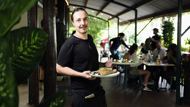 The Petit Cafe has moved from its original location in the Kuranda Markets to a much larger restaurant on Rob Veivers Drive. Petit Cafe front of house manager Sebastian Howell serves up two of the cafe's famous crepe dishes. Picture: Brendan Radke