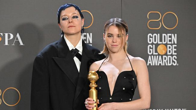 English actor Emma D'Arcy and Australian actress Milly Alcock pose with the award for best drama series for House of the Dragon. Picture: AFP