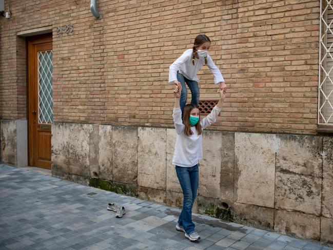 Children in Barcelona continue to wear face masks. Picture: AFP