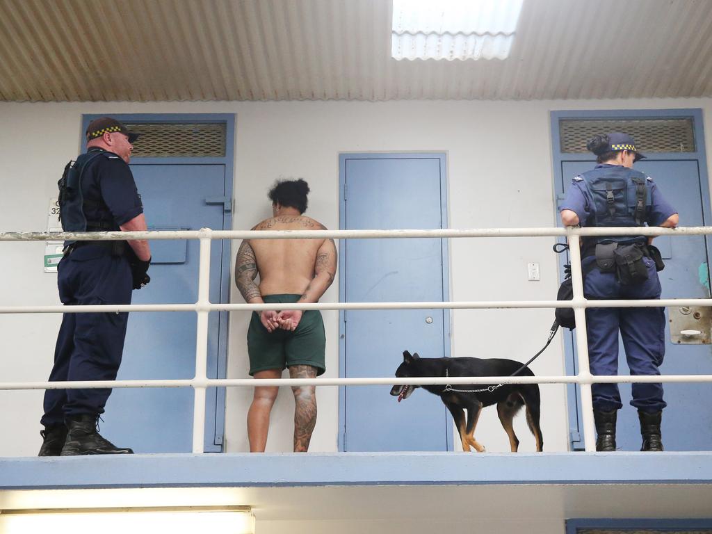 Corrective Services officers raid cells at Silverwater Jail looking for contraband. The officers now wear body cams that record the raids. Picture: Richard Dobson