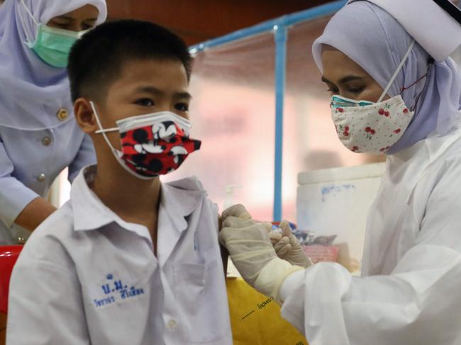 A medical worker administers a dose of the Pfizer vaccine to a school student at a vaccination centre in southern Thailand's Pattani province. Picture: AFP