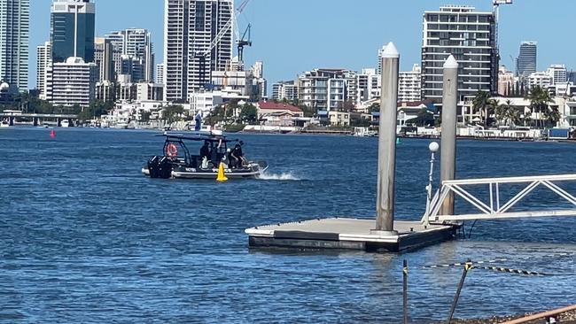 Police divers in the water of the Nerang River during the recovery operation. Picture: Charlton Hart.