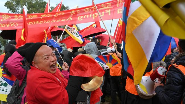 China supporters and protesters outside Australian Parliament House in Canberra. Picture: AAP Image/Mick Tsikas