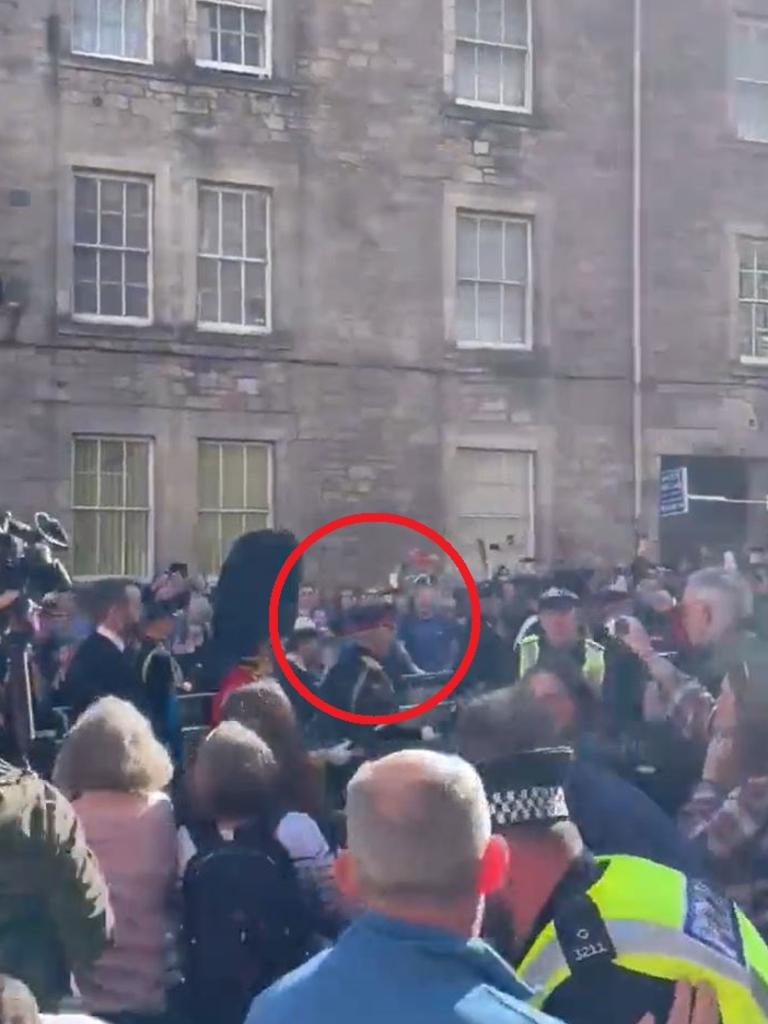 A heckler was tackled the ground who was just metres away from the King and the royal party. Picture: Christopher Marshall/Holyrood Daily/Twitter