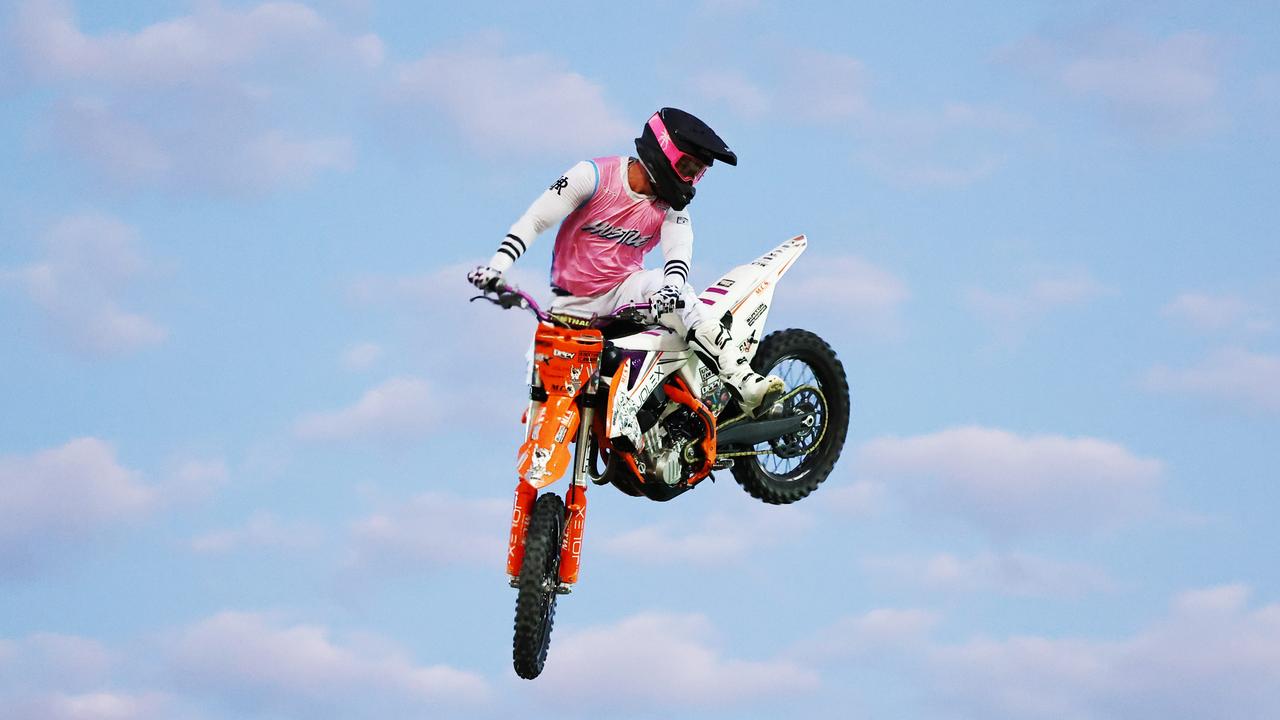 Chevy Olexienko jumps through the flames on his motocross bike at the 2024 Cairns Bull Throttle event, a bikes and bulls show, featuring bull riding and freestyle motocross riders at the Cairns Showgrounds. Picture: Brendan Radke