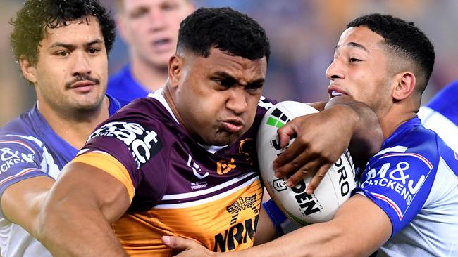 BRISBANE, AUSTRALIA - JULY 18: Tevita Pangai of the Broncos takes on the defence during the round 18 NRL match between the Brisbane Broncos and the Canterbury Bulldogs at Suncorp Stadium on July 18, 2019 in Brisbane, Australia. (Photo by Bradley Kanaris/Getty Images)