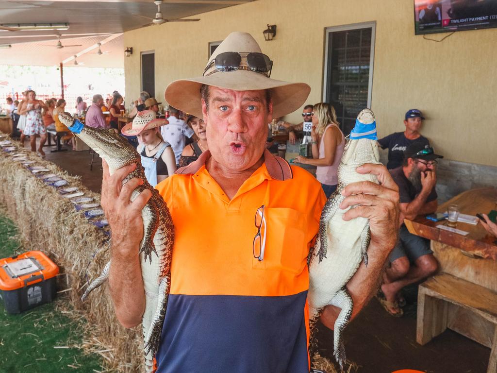 Croc racing at the Berry Springs Tavern for Melbourne Cup Day: John Whitwell, the ‘owner’ of these two crocs that competed in race two. Picture GLENN CAMPBELL