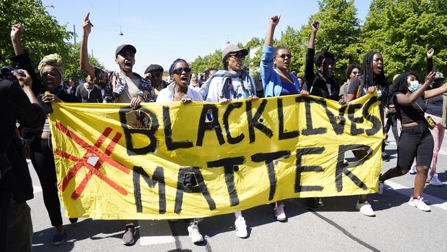 People gather for a Black Lives Matter demonstration in front of the US Embassy in Copenhagen, Denmark.