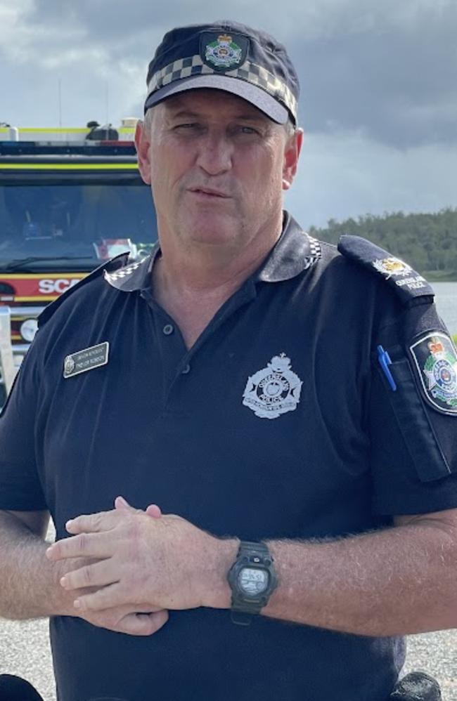 Senior Sergeant Trevor Robson speaks to media amid the search for a father who disappeared in a dam during a family boating trip. PHOTO: Fergus Gregg