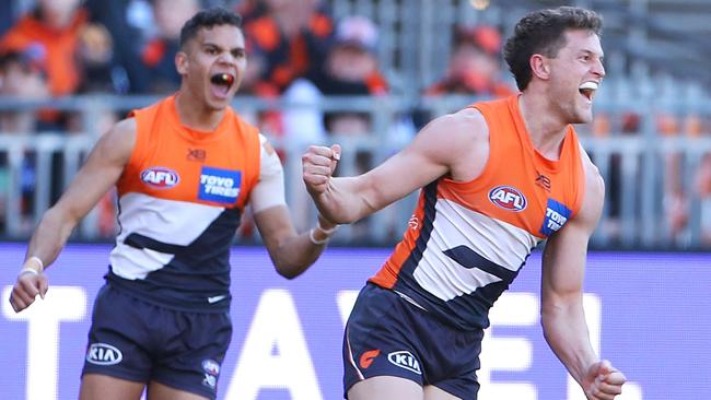 Jacob Hopper celebrates kicking a goal during the clash with the Swans. Picture: AFL Photos/Getty Images