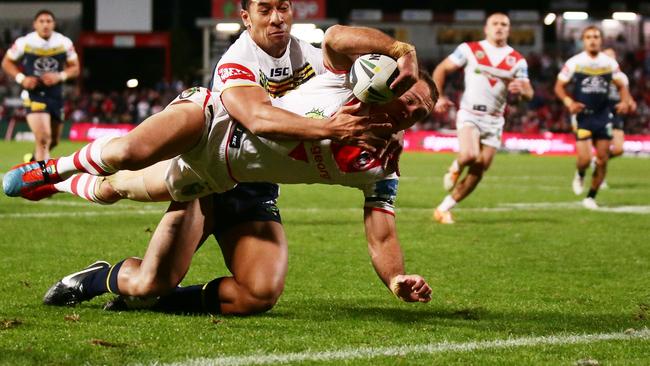 Jason Nightingale scores one of his three tries for the Dragons.