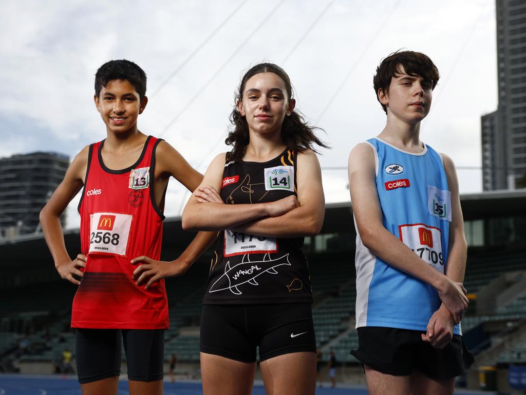 DAILY TELEGRAPH MARCH 20, 2024. Young athletes from left James Mikan, U13s National Record Holder, Caitlin Probets  ALAC NSW Captain 2023 and National Champion for 80m Hurdles and Alexander Evans, MultiClass (wheelchair), National Champion 100m, 200m and State Medallist in Discus, at Sydney Olympic Park Athletic Track. Picture: Jonathan Ng