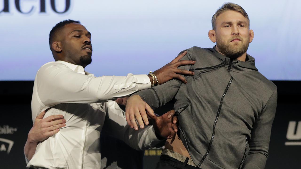 Jon Jones, left, pushes Alexander Gustafsson out of the way during a news conference about their light heavyweight bout.