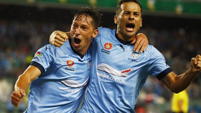 Sydney's Bobo celebrates with teammate Filip Holosko.