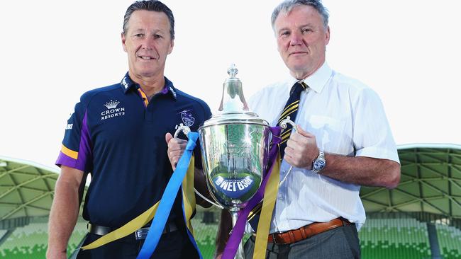 Craig Bellamy and Leeds Rhinos CEO Gary Hetherington pose with the World Club Challenge trophy.