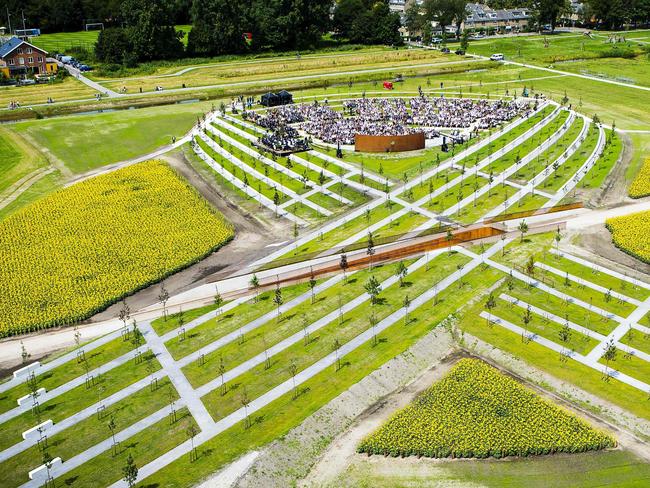 A total of 298 trees have been planted in the shape of a green ribbon, one for each of the victims who died on board the Malaysia Airlines flight. Picture: AFP/ANP/Frank van Beek