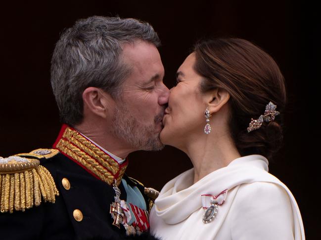 King Frederik X of Denmark kisses Queen Mary of Denmark on the balcony of Christiansborg Palace in Copenhagen. Picture: AFP