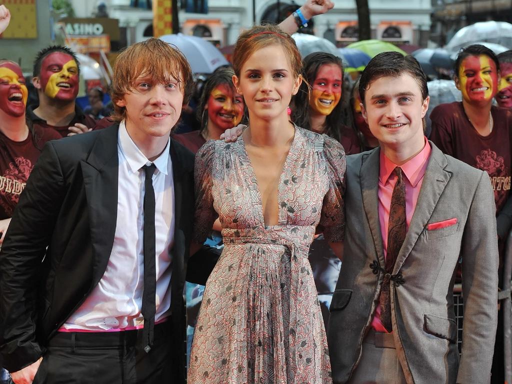 Rupert Grint (right) found the press tours hard to handle. Picture: AFP/Leon Neal 