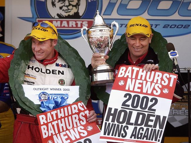 BATHURST - OCTOBER 13: Mark Skaife and Jim Richards of the Holden Racing Team #1 celebrate their win in the 2002 Bob Jane T-Marts Bathurst 1000 V8 Supercar race held at Mount Panorama in Bathurst, Australia on October 13, 2002. (Photo by Robert Cianflone/Getty Images)