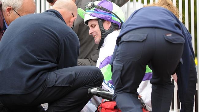 Medical staff attend to Luke Nolen after he was thrown from Bullpit before the first race at Caulfield last weekend. Picture: Ge