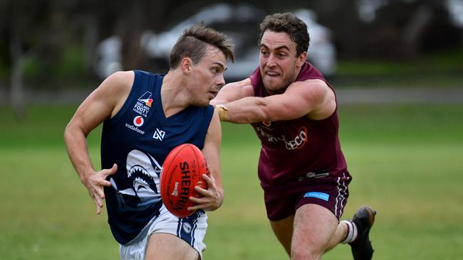 Henley’s Thomas Thunig is pursued by Prince Alfred Old Collegians’ Thomas Brinsley during a division one Adelaide Footy League match in 2019. Picture: AAP/Keryn Stevens