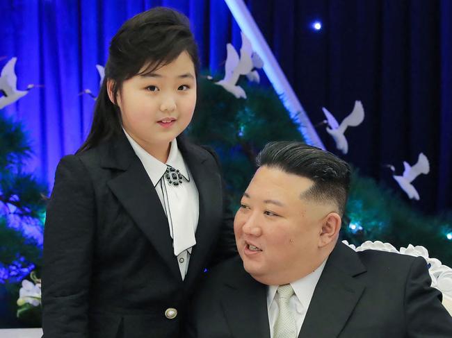 TOPSHOT - This picture taken on  February 7, 2023 and released from North Korea's official Korean Central News Agency (KCNA) on Fenruary 8, 2023 shows North Korean leader Kim Jong Un attending a banquet with his daughter is presumed to be Ju Ae  to mark the 75th anniversary of the Korean People's Army (KPA), in North Korea. (Photo by KCNA VIA KNS / AFP) / South Korea OUT / ---EDITORS NOTE--- RESTRICTED TO EDITORIAL USE - MANDATORY CREDIT "AFP PHOTO/KCNA VIA KNS" - NO MARKETING NO ADVERTISING CAMPAIGNS - DISTRIBUTED AS A SERVICE TO CLIENTS / THIS PICTURE WAS MADE AVAILABLE BY A THIRD PARTY. AFP CAN NOT INDEPENDENTLY VERIFY THE AUTHENTICITY, LOCATION, DATE AND CONTENT OF THIS IMAGE --- /