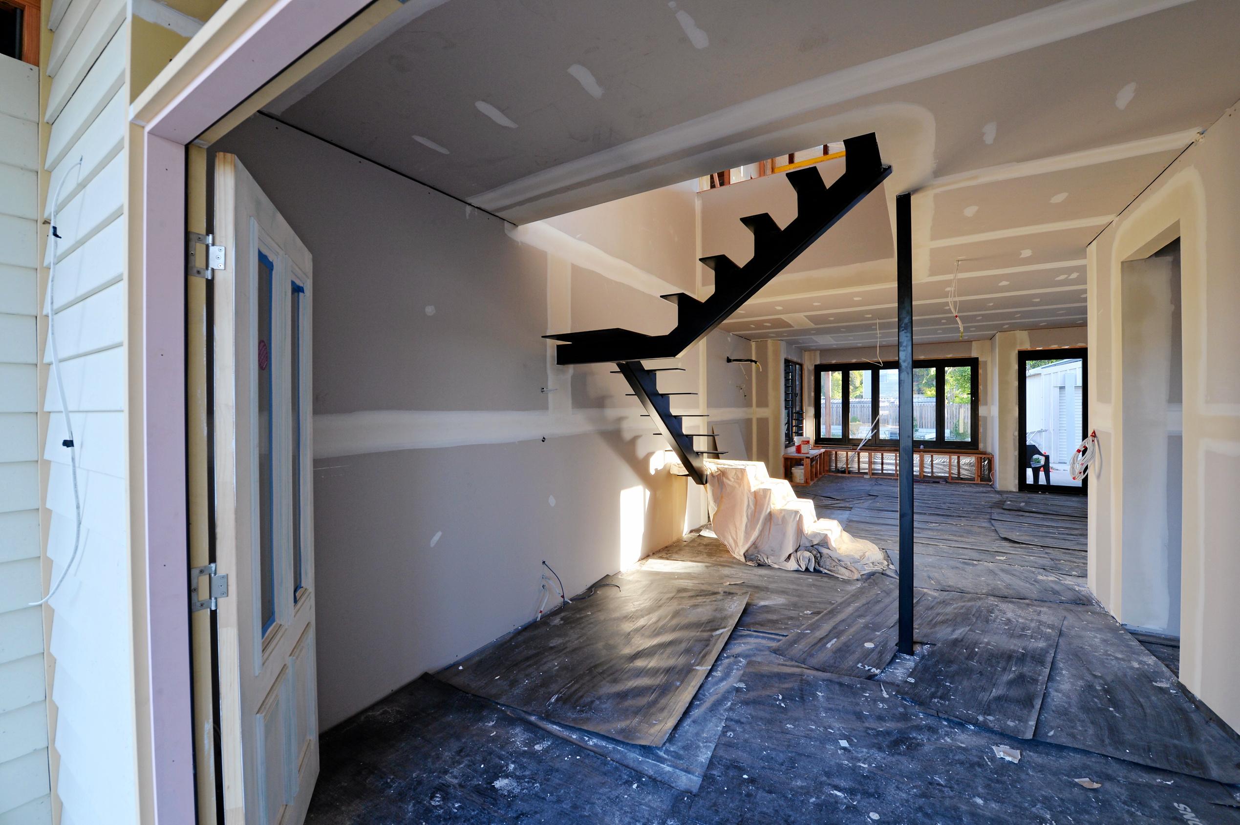 Mackay house-flippers Madison Strutynski and Michael Cotter at their Hunter St, West Mackay property. Picture: Stuart Quinn