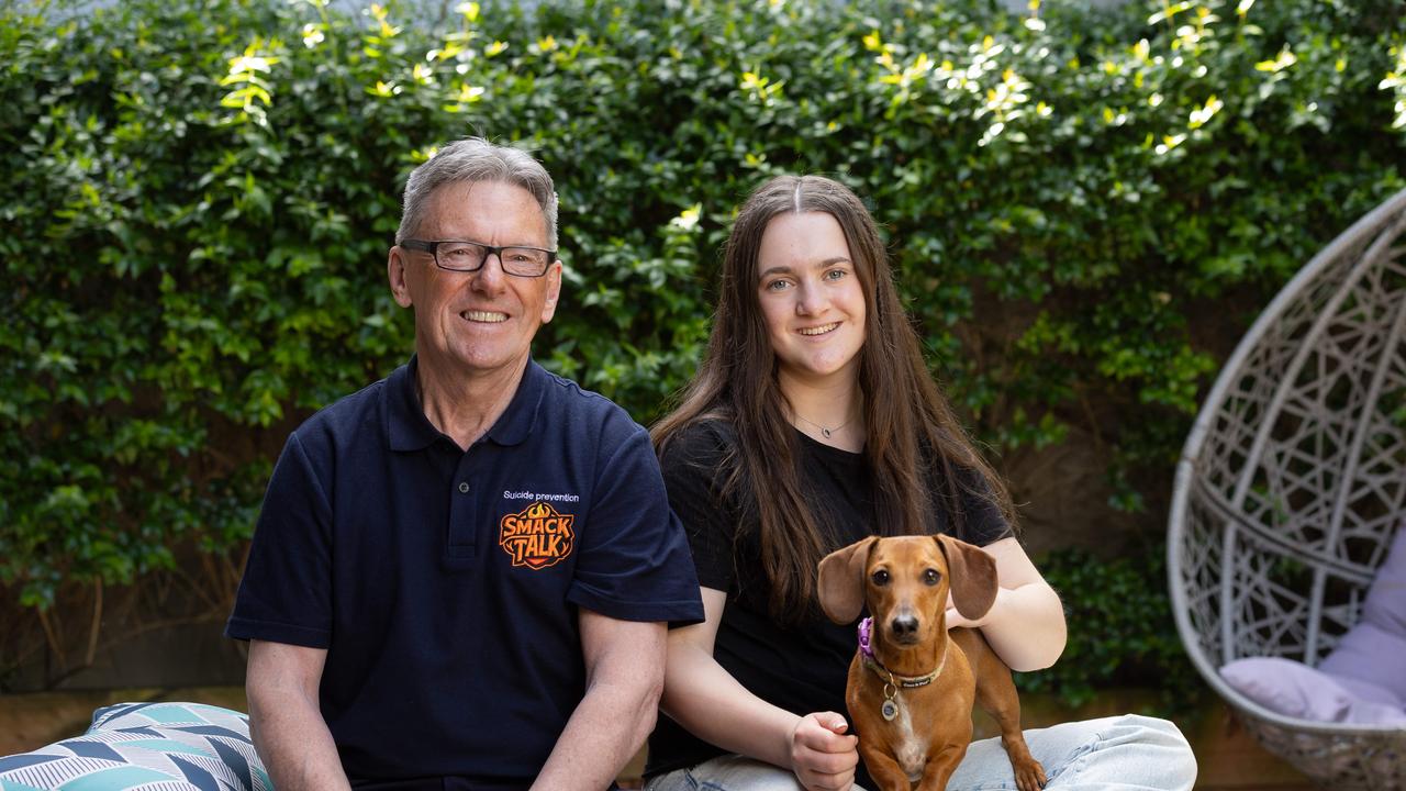 Wayne Holdsworth and daughter Daisy, 15, with Shandy the dog, at home in Melbourne. Picture: Jason Edwards