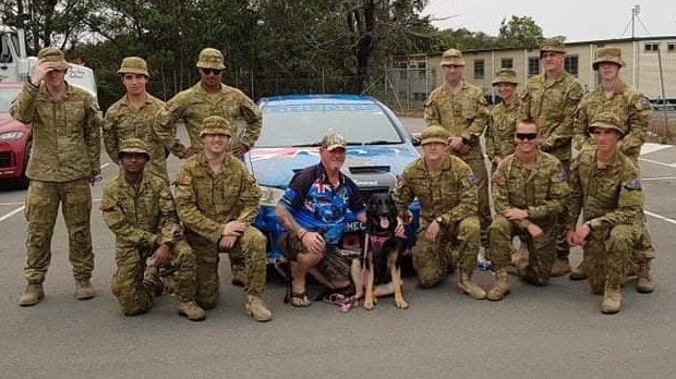 Dakota the PTSD assistance dog and her owner, Glenn Marskell, visiting with some soldiers during the NSW bushfires in January 2020. Picture: Facebook