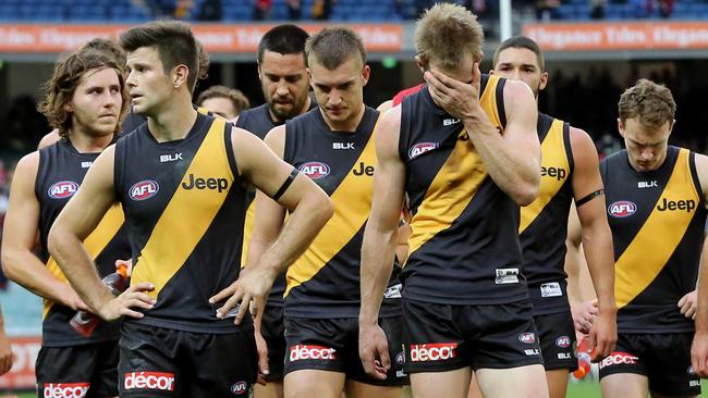 Family family friends and past players Tom has coached will give a guard of honour to the Richmond players as they come on the the ground. Richmond walking off after their loss to Melbourne. Picture: Alex Coppel.