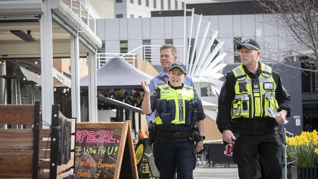 Tasmania Police Sgt. Sarah Crabtree, Transport Safety and Inspection Mark Kramer and Work Safe Tasmania Inspector Glenn Duncan at Salamanca Square. Picture: Chris Kidd