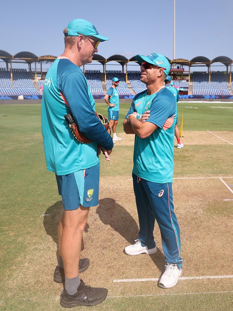 And chatting with Australian coach Andrew McDonald. (Robert Cianflone/Getty Images)