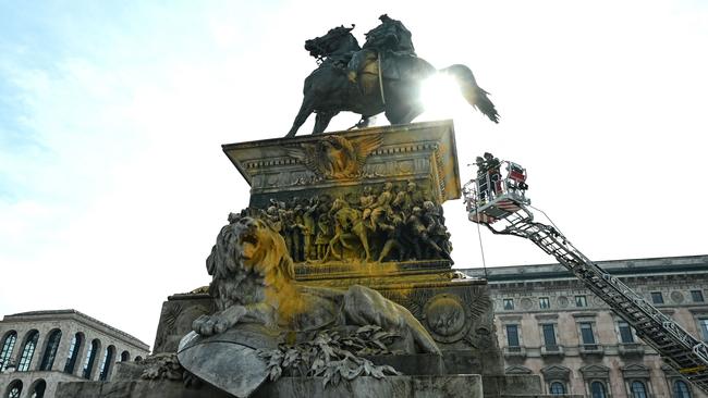 Cleaners worked to restore the statue of Vittorio Emanuele II after Last Generation activists sprayed it with paint. Picture: Piero Cruciatti/AFP