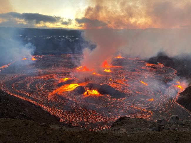 This handout image provided by US Geological Survey (USGS) on June 7, 2023, shows Kilauea erupting from the Halemaumau summit crater within a closed area of Hawai'i Volcanoes National Park in Hawaii. One of the world's most active volcanoes has erupted again, with lava spewing from Kilauea in Hawaii on Wednesday. Footage showed fissures have opened up at the base of a crater on the volcano, which regularly springs to life, with vulcanologists calling the eruption "dynamic." (Photo by US Geological Survey / AFP) / RESTRICTED TO EDITORIAL USE - MANDATORY CREDIT "AFP PHOTO / US Geological Survey / Handout" - NO MARKETING NO ADVERTISING CAMPAIGNS - DISTRIBUTED AS A SERVICE TO CLIENTS