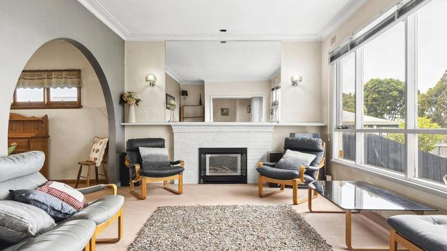 The large living room has plenty of windows drawing natural light into the home.