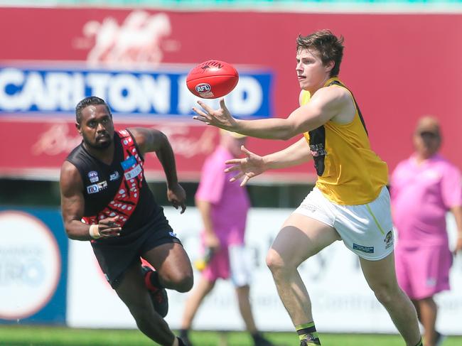 Tigers Matthew Bricknell (ball) asTiwi Bombers V Nightcliff at TIO Stadium.Picture GLENN CAMPBELL