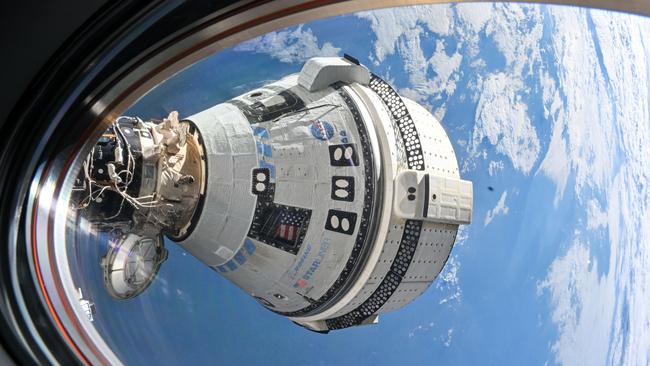 Boeing’s Starliner spacecraft is pictured docked to the Harmony moduleiss071e265073_stk (July 3, 2024) --- Boeing's Starliner spacecraft that launched NASA's Crew Flight Test astronauts Butch Wilmore and Suni Williams to the International Space Station is pictured docked to the Harmony module's forward port. This view is from a window on the SpaceX Dragon Endeavour spacecraft docked to the port adjacent to the Starliner.Image Credit: NASA