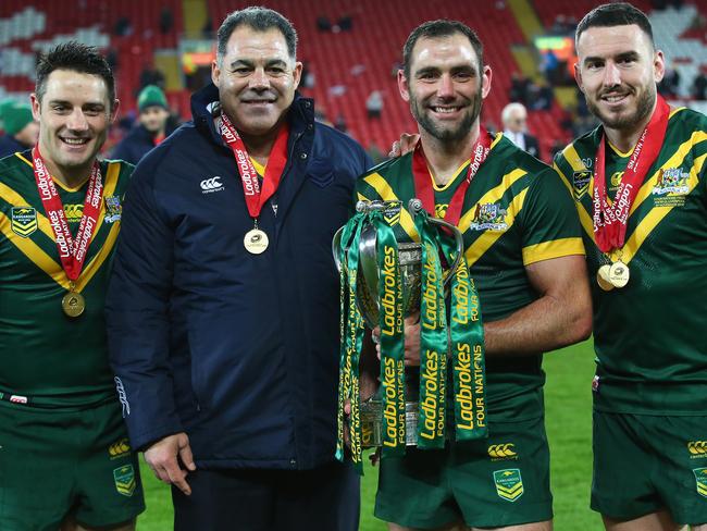 Cooper Cronk, Mal Meninga, Cameron Smith and Darius Boyd with the Four Nations trophy.