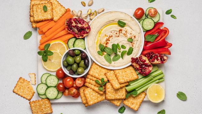 12 healthy supermarket snacks, as chosen by experts. Image: Getty