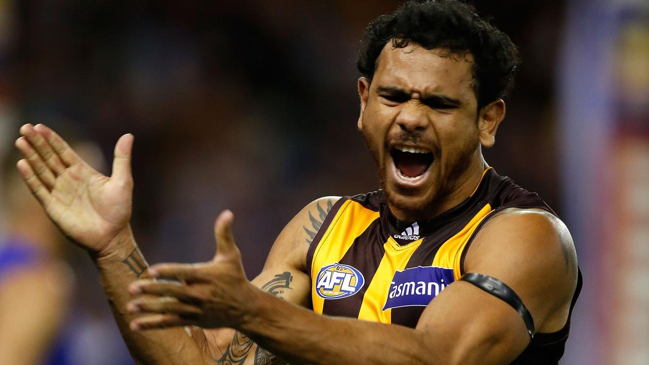 Cyril Rioli celebrates a goal during his time at Hawthorn.